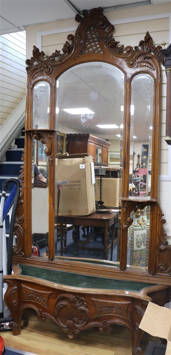 An early 20th century French carved walnut hall mirror, W.5ft H.8ft 10in.